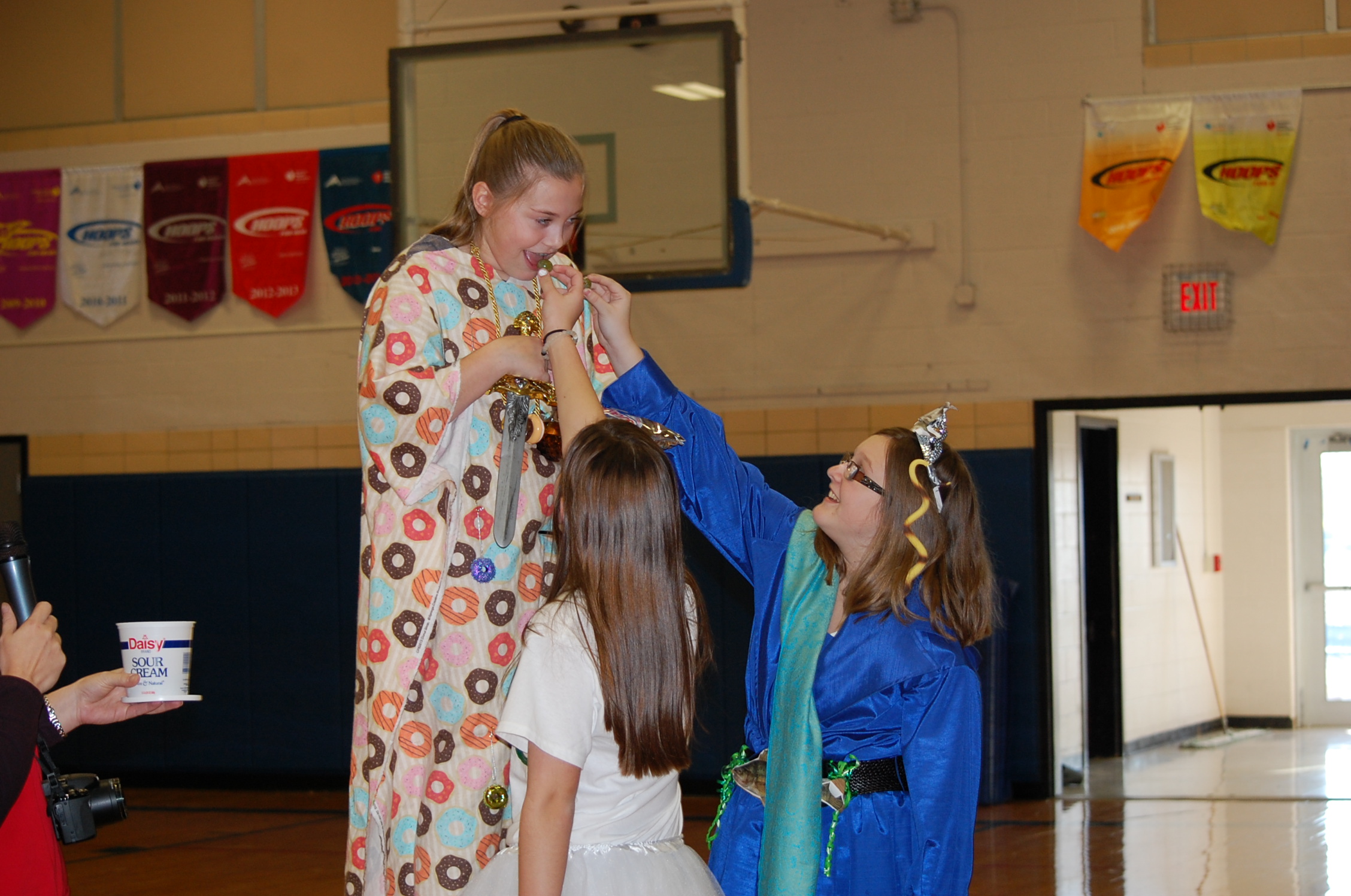 7_winner-of-the-golden-goblet-abby-ayers-is-fed-grapes-by-spencer-hubbuch-and-audrey-risner